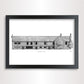 A framed black and white architectural print of 'Tudor Barn Eltham' on a white paper, enclosed in a black frame and shown against a light gray wall.